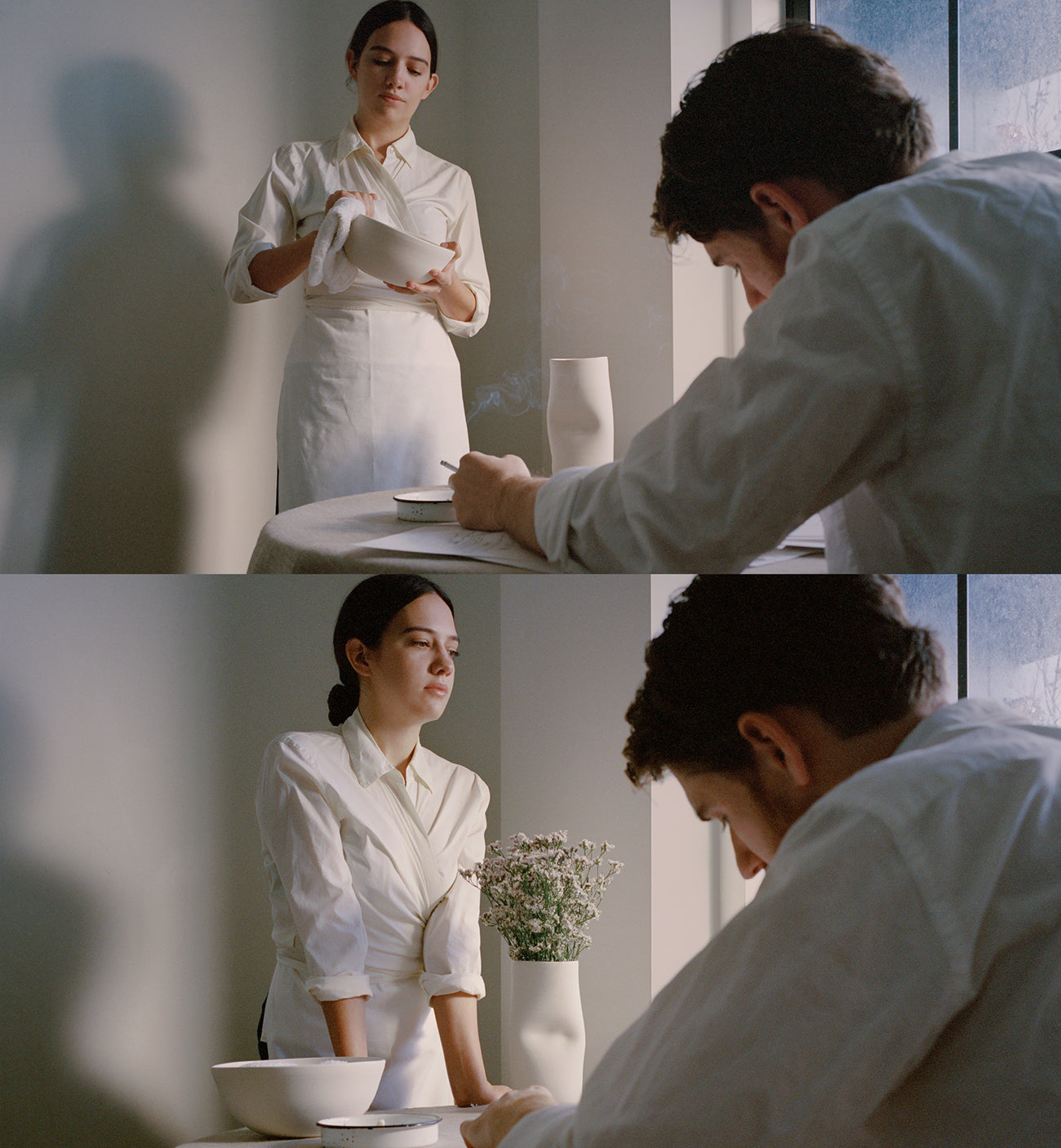 lady in white housekeeper's outfit across from guy writing something on paper, ceramic porcelain on table